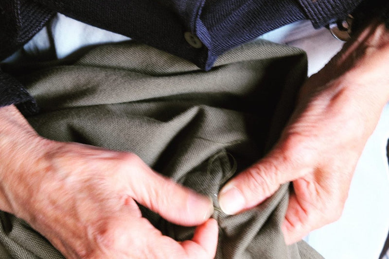 Buttons sewn on by hand